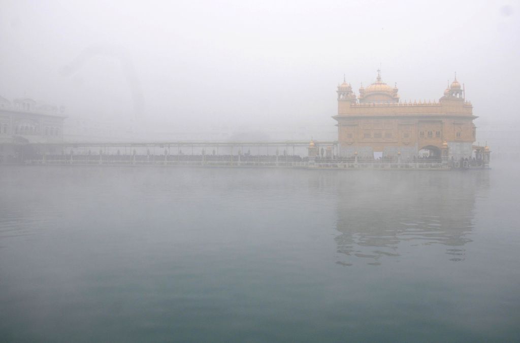 a-blur-view-of-the-golden-temple-on-a-chilly-964651.jpg